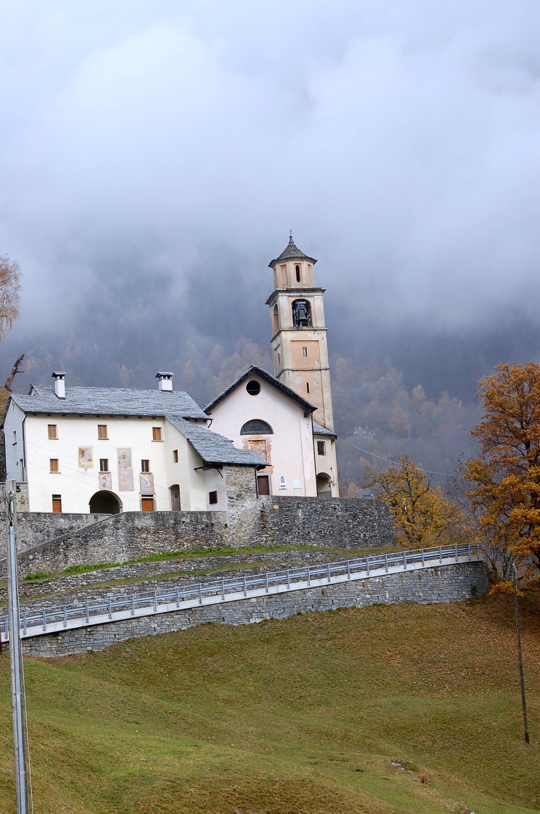 Santa Maria delle Grazie parish church with ossuary and parish house in Switzerland